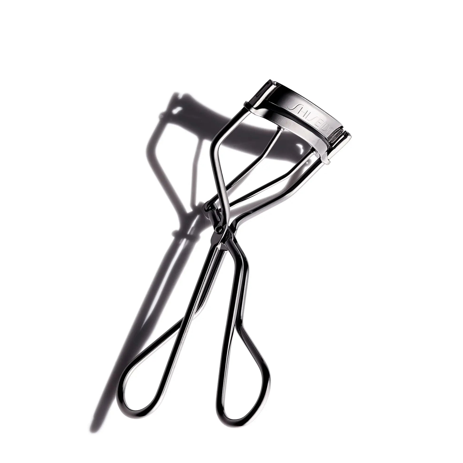 Shiseido Eyelash Curler - Crimps & Curls Lashes for Perfect, Eye-Framing Fringe - Gentle & Safe - Includes Replacement Pad Shiseido uk supplements